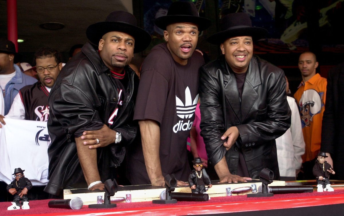 **FILE** Hip hop pioneers RUN-DMC create handprints in cement as they are inducted into Hollywood’s RockWalk Monday, Feb. 25, 2002, in Los Angeles. Jason “Jam Master Jay” Mizell, left, Darryl “DMC” McDaniels, center, and Joseph “DJ Run” Simmons, produced the first rap album to go gold as well as the first rap act nominated for a Grammy. (AP Photo/Krista Niles, File)