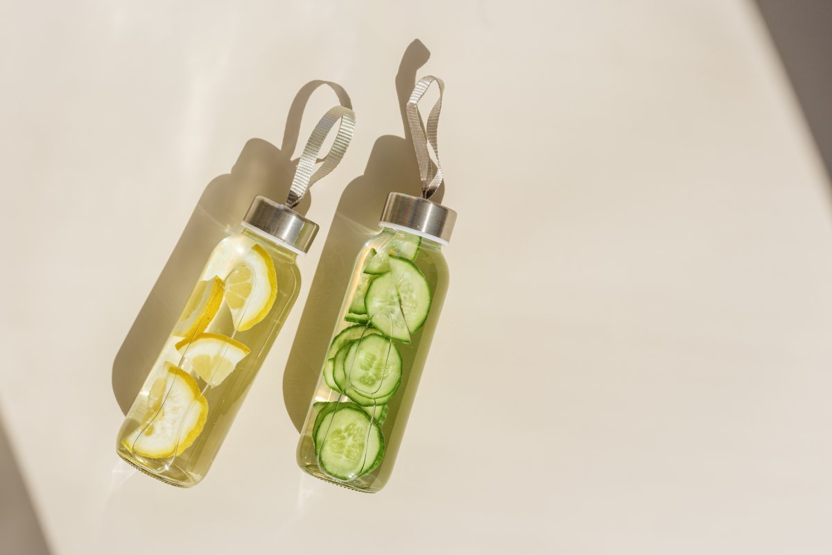 Water bottles woith emon and cucumber in glass bottle